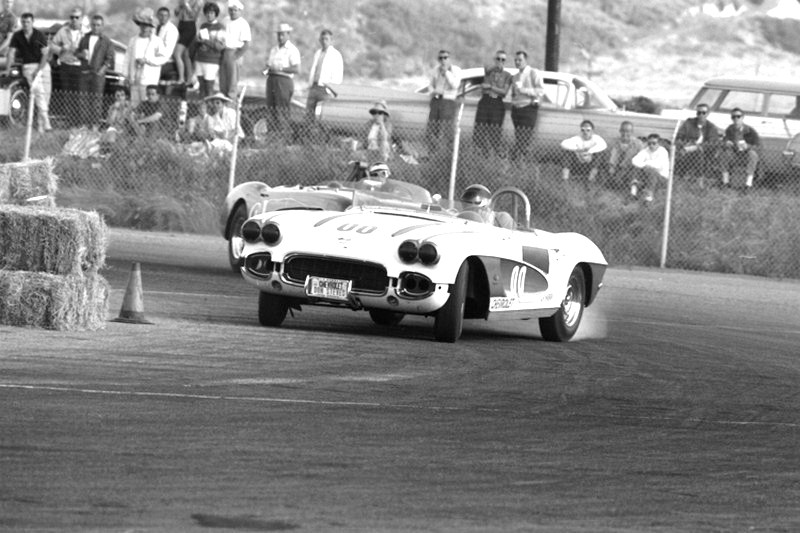 Dave MacDonald drifting his corvette ahead of Paul reinhart at del mar raceway